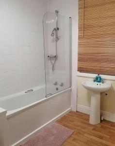 a bathroom with a shower and a sink at The Parkers Arms - The home of Cattlemans Steakhouse in Paignton