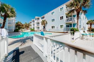 a balcony with a swimming pool and a building at Ocean Retreat & Villas in Myrtle Beach