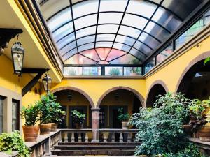 arium of a building with a glass ceiling at Hotel Mansión Virreyes by Rotamundos in San Miguel de Allende