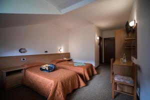 Letto o letti in una camera di Hotel Rio