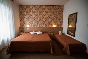 Letto o letti in una camera di Hotel Rio