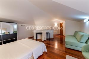 Tempat tidur dalam kamar di Baia da Luz Resort