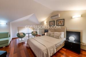 Tempat tidur dalam kamar di Baia da Luz Resort