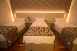 Cama ou camas em um quarto em Grand Carimã Resort & Convention Center