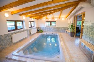 a pool in the middle of a house at Penzion Kryštof in Kovářská
