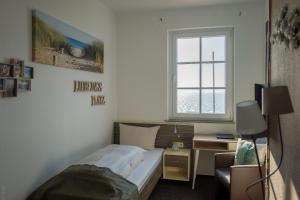 Letto o letti in una camera di AKZENT Strandhotels Seestern, Delphin & Lachs