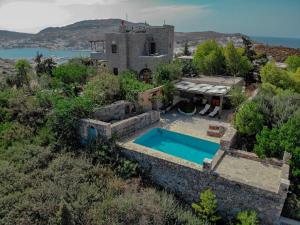 an aerial view of a house with a swimming pool at Blue Vista Patmos in Skala