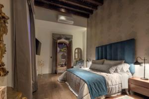 A bed or beds in a room at Casa Barroca