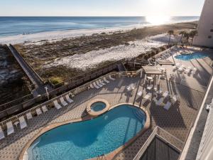 an aerial view of a resort with two swimming pools and a beach at Summerwind in Navarre