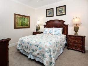 a bedroom with a bed and two night stands at Waterscape A II in Fort Walton Beach