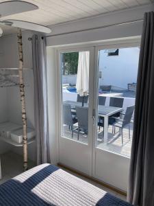 Ένα ή περισσότερα κρεβάτια σε δωμάτιο στο Villa Blanche