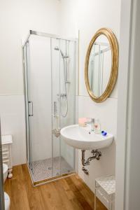 a bathroom with a shower and a sink at ForliHouse in Forlì +8 photos
