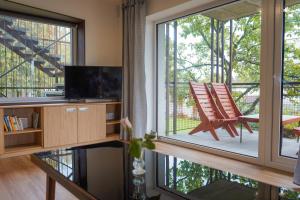 TV a/nebo společenská místnost v ubytování Vila Věkoše - apartmán s terasou a zahradou