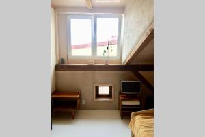 Televízia a/alebo spoločenská miestnosť v ubytovaní Caly apartament