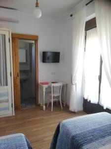 Μια τηλεόραση ή/και κέντρο ψυχαγωγίας στο Hostal el lugar de la Mancha