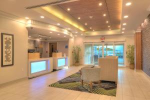 a lobby of a hospital with a waiting room at Holiday Inn Express Hotel & Suites Mobile Saraland by IHG in Saraland +37 photos