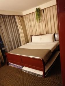 Кровать или кровати в номере KL Time Square suit At Times square