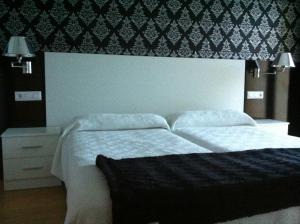 Кровать или кровати в номере Apartamentos Turisticos Estrella del Alemar