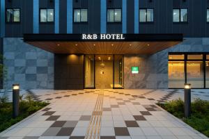 an entrance to a hotel with a checkered floor at Washington R&B Hotel Nagoya Shinkansenguchi in Nagoya