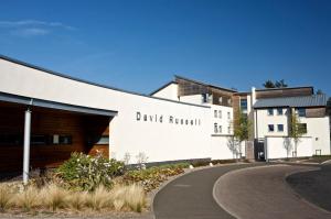 a building with a sign that reads drug rehab at David Russell Apartments - Campus Accommodation in St. Andrews