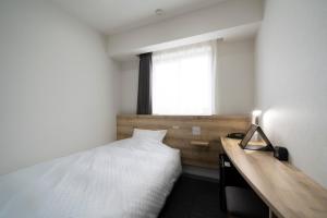 Gulta vai gultas numurā naktsmītnē Washington R&B Hotel Nagoya Shinkansenguchi