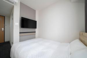 Gulta vai gultas numurā naktsmītnē Washington R&B Hotel Nagoya Shinkansenguchi