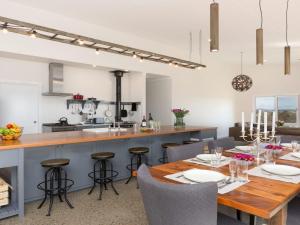 a kitchen and dining room with a table and chairs at On a Hill in Marlow +18 photos