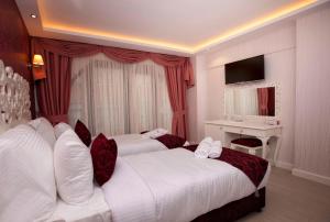 Postel nebo postele na pokoji v ubytování Dream Bosphorus Hotel