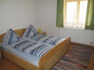 Łóżko lub łóżka w pokoju w obiekcie Bamerhof