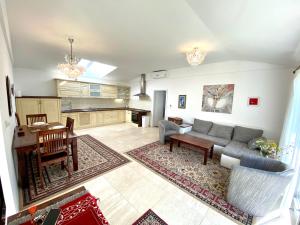 a living room with a couch and a table at Pension Julia in Banka