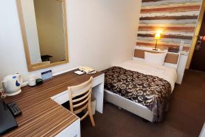 Postel nebo postele na pokoji v ubytování Tachikawa Regent Hotel + 29 fotografií
