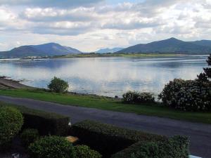 a view of a lake with mountains in the distance at Ivy House Holiday Home in Valentia Island