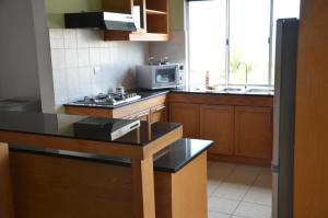 Kuchyň nebo kuchyňský kout v ubytování Tamarin Chambres d'Hotes