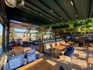 a restaurant with tables and chairs on a patio at Antalya Inn Hotel in Antalya