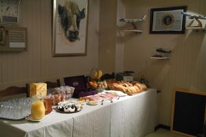 a table with food and drinks on top of it at De Bonte Os Hotel & Tower in Roeselare