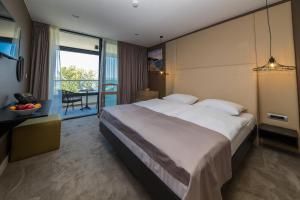 Postel nebo postele na pokoji v ubytování Boutique Hotel Esplanade