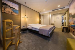 Postel nebo postele na pokoji v ubytování Boutique Hotel Esplanade