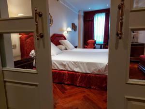 Cama ou camas em um quarto em Hotel Alameda Palace