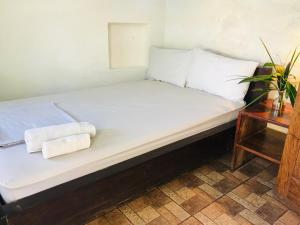 Postel nebo postele na pokoji v ubytování Cafe Central