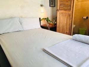 Postel nebo postele na pokoji v ubytování Cafe Central
