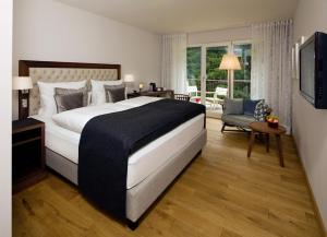 Letto o letti in una camera di Waldhotel Stuttgart