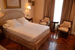 Cama ou camas em um quarto em Hotel Alameda Palace