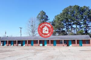 a building with a sign that reads surprise cream at OYO Hotel Durant MS Bowling Green Rd in Durant