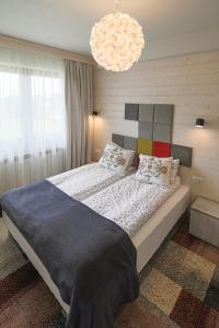 Posteľ alebo postele v izbe v ubytovaní Villa Moje Tatry 2