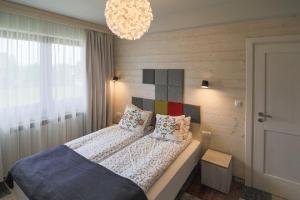 Posteľ alebo postele v izbe v ubytovaní Villa Moje Tatry 2