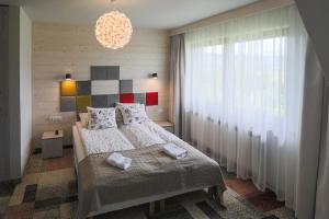 Posteľ alebo postele v izbe v ubytovaní Villa Moje Tatry 2 + 37 fotografií