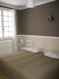Łóżko lub łóżka w pokoju w obiekcie Auberge Les Myrtilles