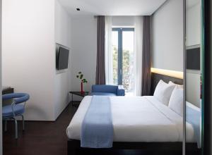 Postel nebo postele na pokoji v ubytování Domotel Kastri
