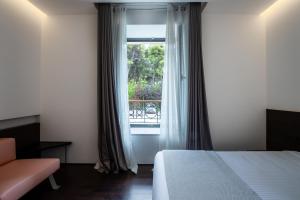 Postel nebo postele na pokoji v ubytování Domotel Kastri