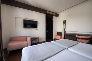Postel nebo postele na pokoji v ubytování Domotel Kastri